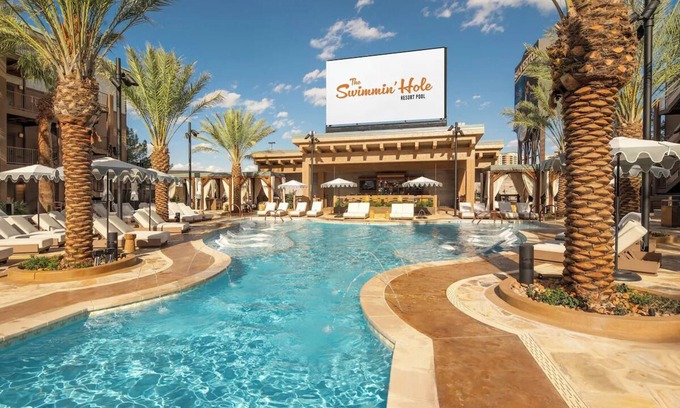 Enterprise Hotel | Relax in Comfort with a King Bed and Stunning Poolside Views