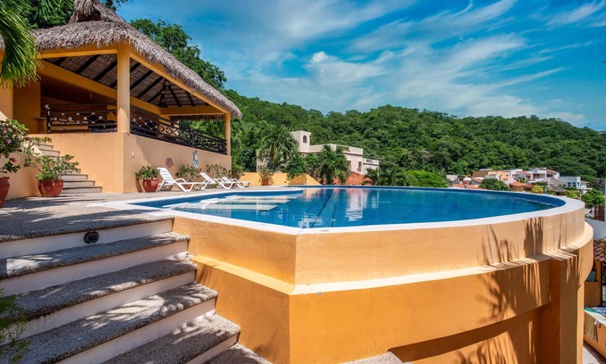 Crucecita Casa | Relax in this spacious home in a quiet community with shared pool and BBQ area