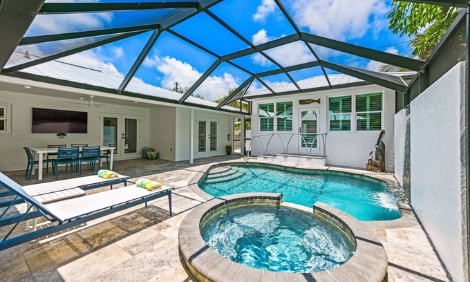 Bay Isle Casa | REMODELED, Heated Pool and Spa, POOL Table, games, bikes included!