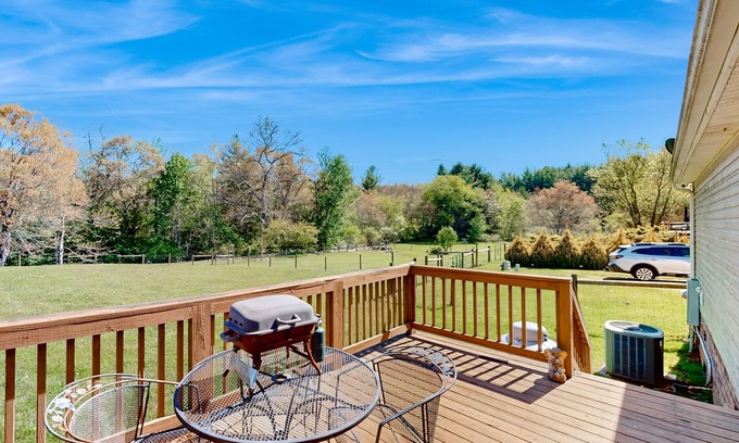 Sparta Casa | Riverfront home with a large yard, fireplace, deck, & washer/dryer