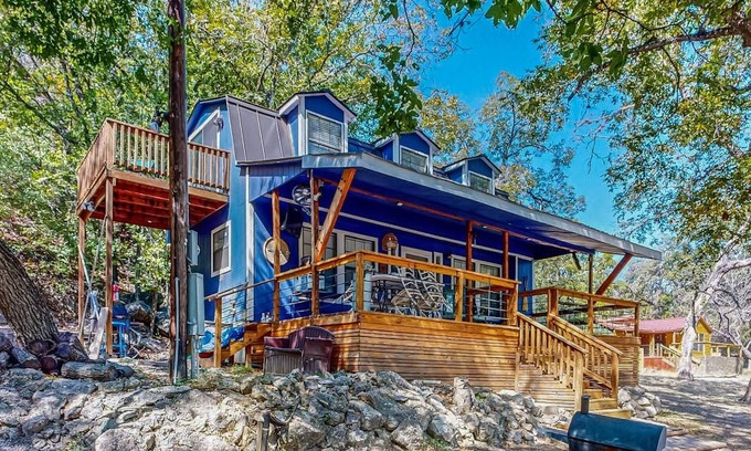 Bandera Cabaña | Riverside Retreat with outside dining area, deck and internet
