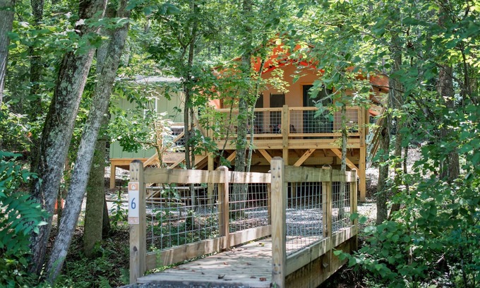 Mill Spring Casa | Safari Tent nestled in the woods, creek side, furnished balcony, pet friendly, sleeps 5.