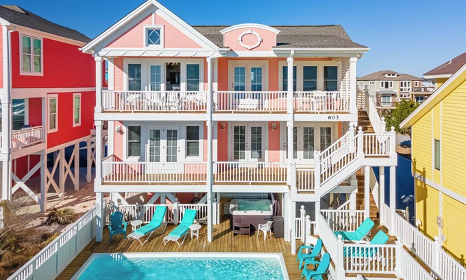Holden Beach Casa | "Salty Pink Flamingo" is a stunning 6-bedroom, 4-bathroom oceanfront retreat with a private pool, hot tub, and elevator.