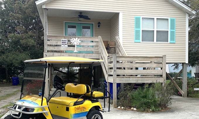 Surfside Beach Casa | 'Pies Retiro de Sandy ... Pasos de la playa, Se aceptan mascotas, Familia Beach Cottage