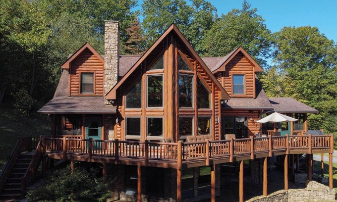 Huntly Casa | Secluded 4 bedroom log style home with screened porches, deck and fishing pond.