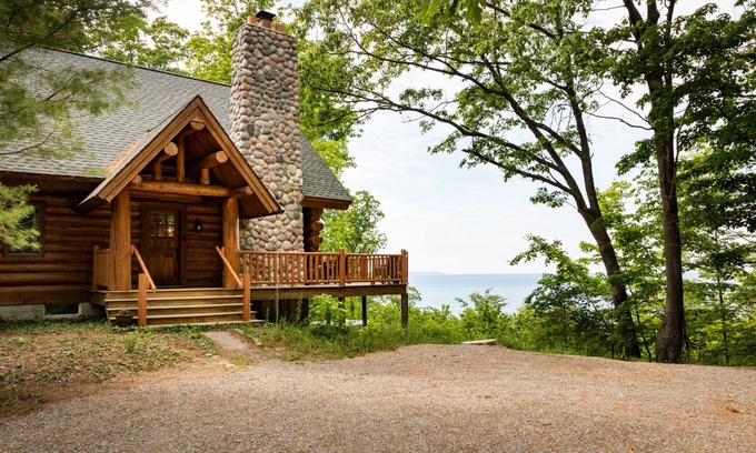 Lake Leelanau Cabina | Secluded Log Cabin Retreat on 11 Wooded Acres with Hot Tub & Lake Michigan Views