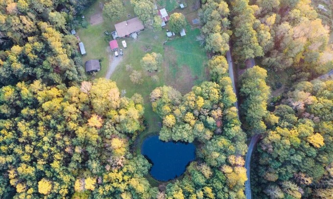 Apex Casa | Serene Log Home w pond, fenced-in yard & pastures