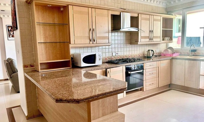 Masaki Apartamento | Spacious 3-bedroom apartment in vibrant Dar es Salaam with WiFi AC Swimming pool