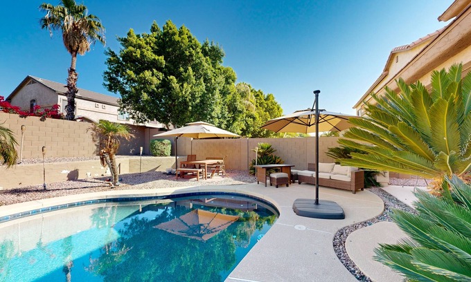 Glendale Casa | Spacious home surrounded by palms with pool, grill, children's items, & W/D