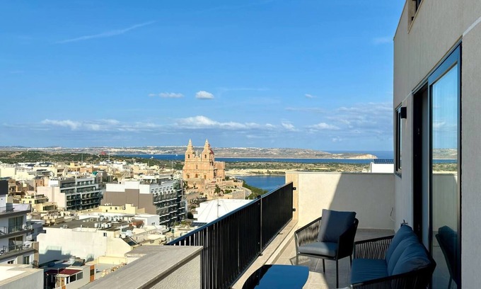 Mellieħa Heights Apartamento | Step inside to discover a modern and elegantly decorated space, featuring two spacious bedrooms with ample storage, ensuring a restful and convenient stay. The open-plan living area boasts contemporary furnishings, providing a chic and cozy atmospher