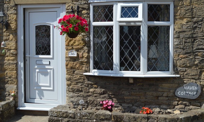 Snainton Cabaña | Stone Holiday Cottage en Scarborough con cama con dosel y literas
