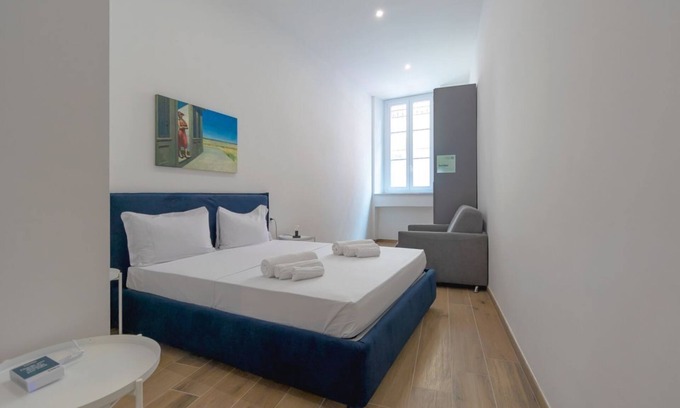 San Donato - Campidoglio Apartamento | Studio apartment with double bed, armchair bed and equipped kitchenette.