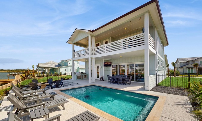 Rockport Casa | Stunning canal front home with private pool, fire pit, and boat dock