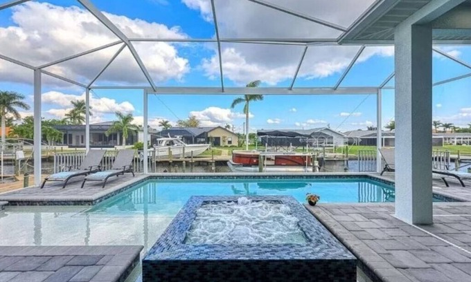 Eight Lakes Casa | Stunning New Waterfront Luxury Villa with oversized Heated pool and Hot tub!