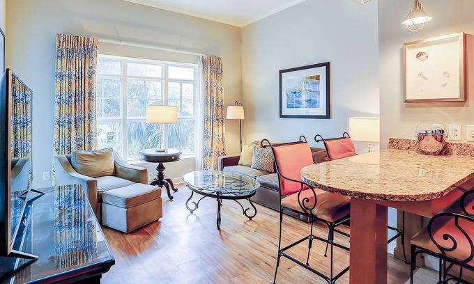 Isle of Palms Condominio | Stylish condo near beach & golf with balcony, W/D, pool, hot tub, & firepit
