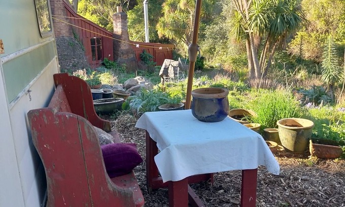 Akaroa Casa | Stylish vintage caravan on a farm over looking bush and river.