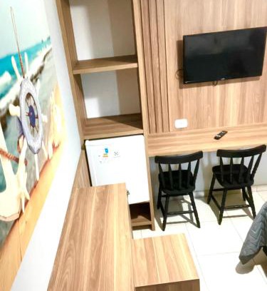 Foguete Hotel | Suíte 31 Privativa com ar condicionado, Frigobar, Vista lateral para o mar, 5 mts da praia