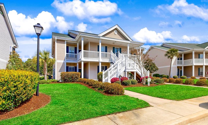 Sunset Beach Condominio | Sunset Village top-floor end unit with golf & pond views, pools & hot tub