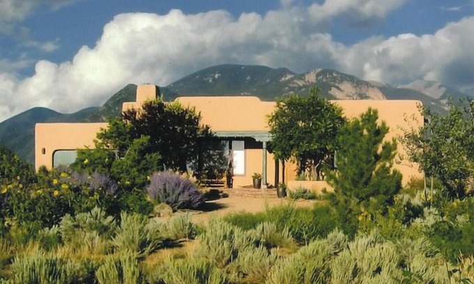 Arroyo Seco Casa | Sweeping panoramic mountain views, expansive adobe privacy wall system