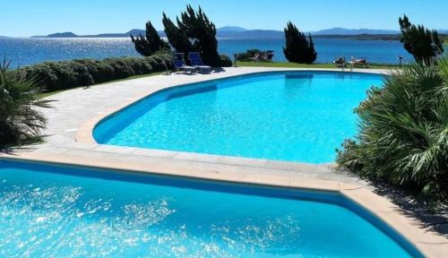 Baia Caddinas Apartamento | Swimming pool & Beach access Residence