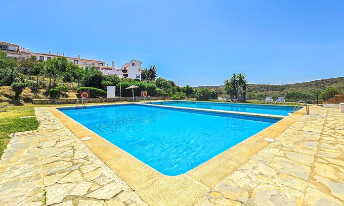 Alcorrin Apartamento | Tasteful vacation apartment with shared outdoor pool and beautiful sea view.
