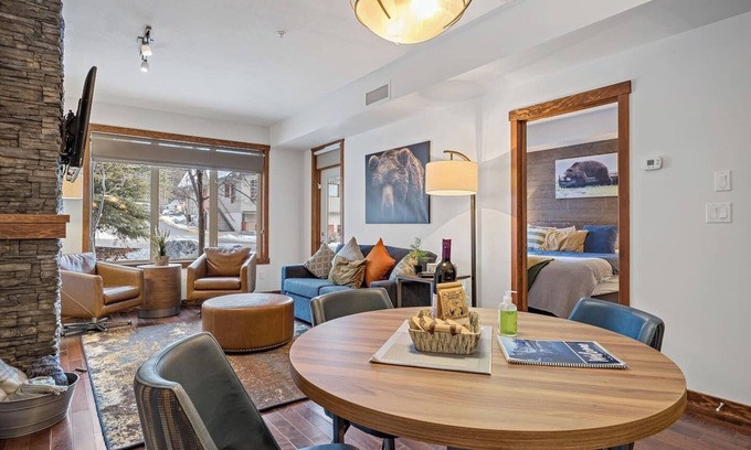 Cougar Creek Hotel | The Den | Outdoor Hot Tub + Pool | Walkout Patio