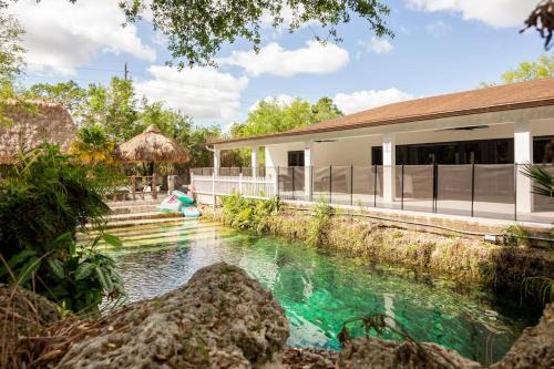Homestead Casa | The Lake House Mia Natural Pool Wellness Center Pool Table Ping Pong Family