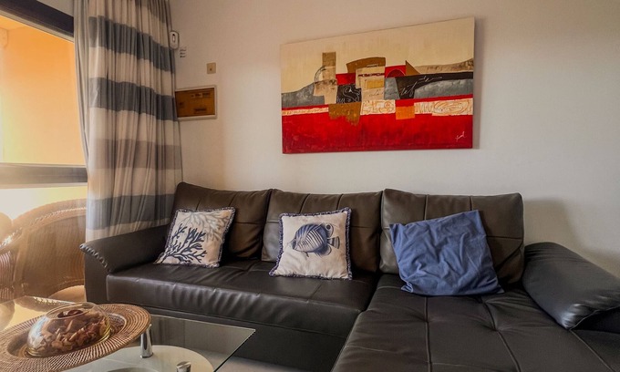 Costa Meloneras Casa | Casa de tres plantas en Meloneras con jardines privado y piscina comunitaria