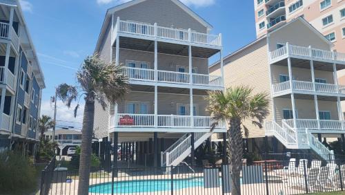 North Myrtle Beach Casa | Tropical Dunes I - 8 Bedroom Oceanfront Home - Private Pool Game Room and Elevator