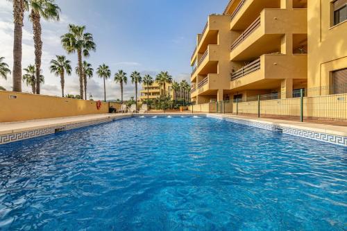 Sotogrande Apartamento | Tropical Sunset Paradise with Pool and Free Parking