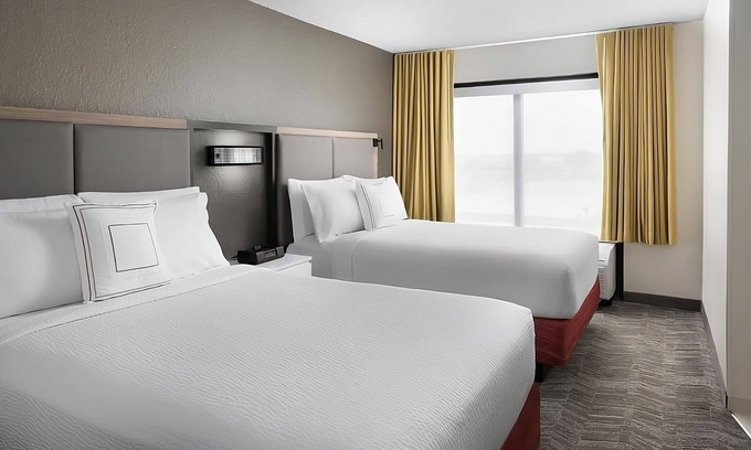 Southeast Houston Hotel | Two Family Ready Rooms w/ Living Area, Pool, and Daily Free Breakfast