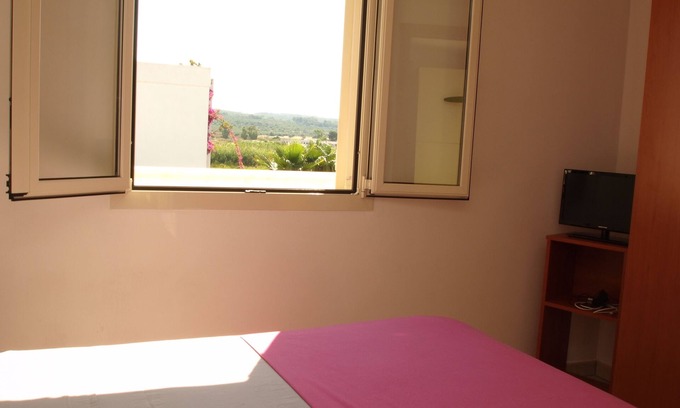 Torre Mozza Apartamento | Ático de dos habitaciones con vistas a solo 100 metros de la playa de Torre Mozza.