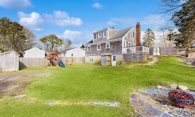 Harwich Casa | Two-story dog-friendly retreat with enclosed yard, playset, W/D, & firepit