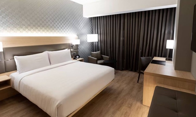 Armendariz Hotel | Unwind with Partial Ocean Views | Ambient Glow and Elegant Coastal Touches