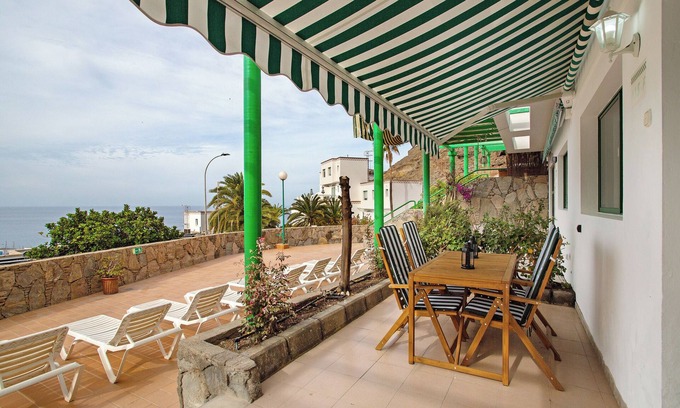 Puerto Rico Apartamento | Apartamento de vacaciones 'Casa Los Veleros F1' con vistas al mar, Wi-Fi y aire acondicionado