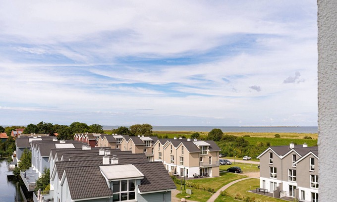 Schillig Apartamento | Vacation apartment with a view of the sea and meadows, sauna & electric fireplace for relax