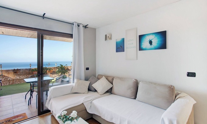 Puerto Rico Apartamento | Casa de vacaciones "Sunset" con vistas al mar, piscina compartida y Wi-Fi