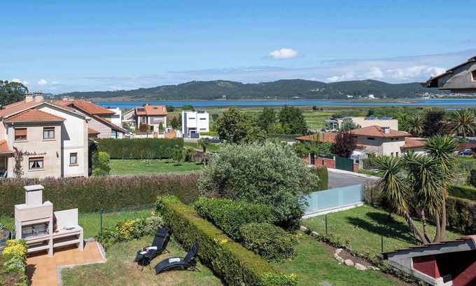 Quintans Villa | Casa La Lanzada (207), con jardín y vistas al mar