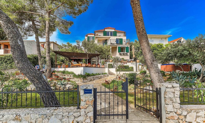 Businci Villa | Villa Strmo - Trogir-Ciovo-waterfront villa, hot tub, boat, summer kitchen.