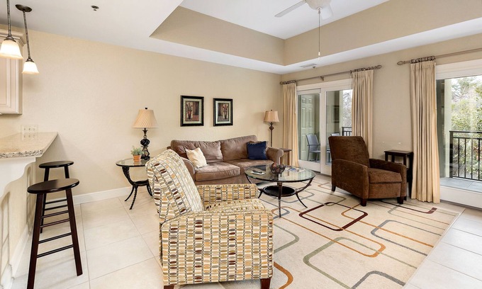 Demere Park Condominio | Walk or Bike to Pier and Village from Salt Air Villas! Community Pool and Private Balcony