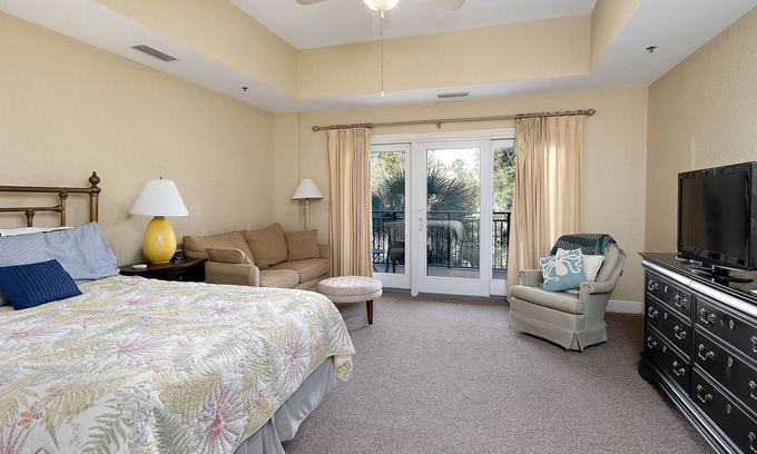 Demere Park Condominio | Walk or Bike to Pier and Village from Salt Air Villas! Community Pool and Private Balcony