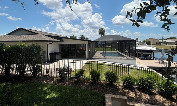 Iona Shores Casa | Waterfront Canal Home. Boat Dock, Fishing, Heated Pool