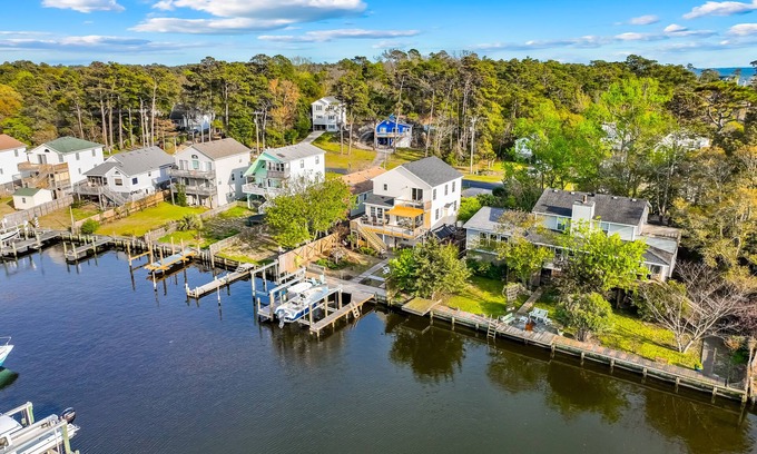 Colington Harbour Casa | Waterfront home and Oasis with private dock, outdoor bar and firepit