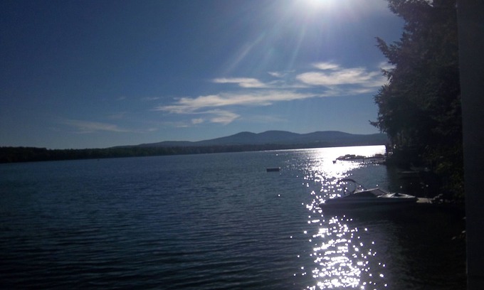 Laconia Casa | WATERFRONT HOME BOAT HOUSE BOAT SLIPS PANORAMIC LAKE AND GUNSTOCK MOUNTAIN VIEW