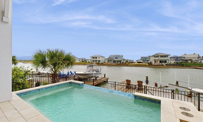 Rockport Casa | Waterfront luxury with private dock, outdoor kitchen, infinity pool & pier