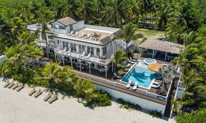 Tar Bay Villa | Zen Exuma: Stunning Beachfront Villa w/ NEW Rooftop Lounge, Spa, Cabana & Pool!