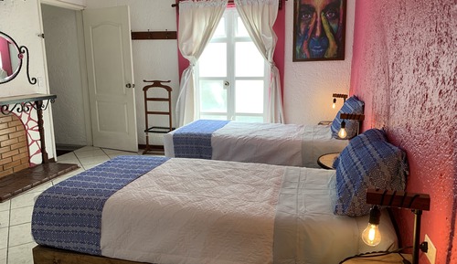 Habitación junior con 1 cama doble o 2 individuales