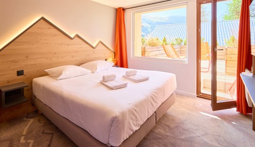 Habitación Club con 1 cama doble o 2 individuales