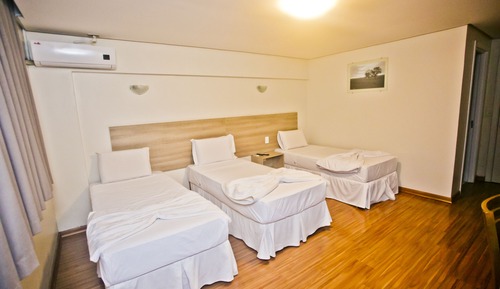 Habitación triple ejecutiva, varias camas