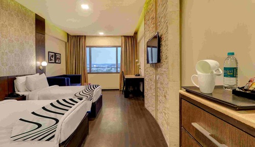 Habitación Club con 1 cama doble o 2 individuales